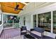 Comfortable porch with wooden ceiling and fan, perfect for relaxing outdoors at 437 Valley Brook Ne Dr, Atlanta, GA 30342