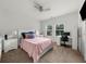 Inviting bedroom featuring desk, ceiling fan, and a bright, sunlit window at 4425 Martel Dr, Cumming, GA 30040