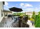 Outdoor deck with table, grill, and umbrella, perfect for enjoying the outdoors at 4425 Martel Dr, Cumming, GA 30040