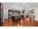 Modern kitchen with stainless steel appliances, granite countertops, and a breakfast bar at 4425 Martel Dr, Cumming, GA 30040