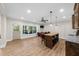Spacious living area with a bar, backyard access, and plentiful sunlight at 4425 Martel Dr, Cumming, GA 30040