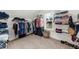 Spacious walk-in closet with extensive shelving and hanging storage, plus window at 4425 Martel Dr, Cumming, GA 30040