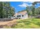 Backyard featuring a partially-above-ground pool, large grassy area, and patio at 2085 Castle Royale Dr, Lawrenceville, GA 30043