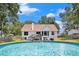 Backyard featuring a pool, a deck with seating, and a manicured lawn at 2085 Castle Royale Dr, Lawrenceville, GA 30043