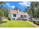 Spacious backyard with an elevated deck, in-ground pool and lots of green lawn at 2085 Castle Royale Dr, Lawrenceville, GA 30043