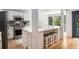 Bright, remodeled kitchen with stainless steel appliances, quartz countertops, and stylish tile backsplash at 2085 Castle Royale Dr, Lawrenceville, GA 30043