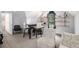 This living room offers a seating area with table and chairs, and shelving for décor and storage at 2085 Castle Royale Dr, Lawrenceville, GA 30043