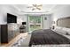 The spacious main bedroom has a large window with views and a desk area, ideal for working from home at 2085 Castle Royale Dr, Lawrenceville, GA 30043