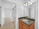Bathroom vanity with granite countertop and open view to the bedroom at 2865 Lenox Ne Rd # 103, Atlanta, GA 30324