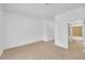 A bedroom with carpet and an open entry to a bathroom at 2865 Lenox Ne Rd # 103, Atlanta, GA 30324