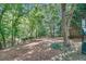 Community dog park with lush trees and benches providing a great space for pet owners at 2865 Lenox Ne Rd # 103, Atlanta, GA 30324