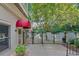 Exterior view of a building with a red awning and a fenced entrance to a pool area at 2865 Lenox Ne Rd # 103, Atlanta, GA 30324