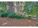 Multi-level home with balconies surrounded by mature trees and green landscaping at 2865 Lenox Ne Rd # 103, Atlanta, GA 30324