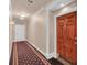 Hallway featuring a carpet runner and view of unit entry door at 2865 Lenox Ne Rd # 103, Atlanta, GA 30324