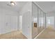 Hallway featuring multiple access doors and a mirrored wall at 2865 Lenox Ne Rd # 103, Atlanta, GA 30324