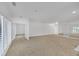 Expansive living area with bright neutral walls, plush carpet and bright natural light at 2865 Lenox Ne Rd # 103, Atlanta, GA 30324