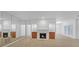 Spacious living room with a fireplace, built in cabinetry and large mirrors at 2865 Lenox Ne Rd # 103, Atlanta, GA 30324