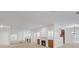 Bright living room features a fireplace and large mirror wall reflecting ample natural light at 2865 Lenox Ne Rd # 103, Atlanta, GA 30324