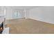 Spacious living room with plush carpeting and a cozy fireplace, perfect for relaxation at 2865 Lenox Ne Rd # 103, Atlanta, GA 30324