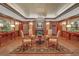 Lobby featuring a chandelier, wood paneled walls, fireplace, and elegant furnishings at 2865 Lenox Ne Rd # 103, Atlanta, GA 30324
