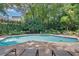 Beautiful outdoor pool area with lounge chairs and lush landscaping at 2865 Lenox Ne Rd # 103, Atlanta, GA 30324