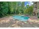 Relaxing pool area surrounded by lush greenery and comfortable lounge chairs at 2865 Lenox Ne Rd # 103, Atlanta, GA 30324