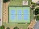 Aerial view of the community tennis courts with pristine blue courts and surrounding landscaping at 3372 English Oaks Nw Dr, Kennesaw, GA 30144
