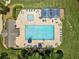 Aerial view of the community pool featuring lounge chairs, umbrellas, and a pool at 3372 English Oaks Nw Dr, Kennesaw, GA 30144