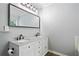 Bathroom featuring double sinks with granite countertops and modern fixtures at 3372 English Oaks Nw Dr, Kennesaw, GA 30144