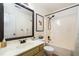 Cozy bathroom features a shower-tub combo, decorative mirror, and updated fixtures at 3372 English Oaks Nw Dr, Kennesaw, GA 30144