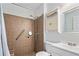 Accessible bathroom with tiled walk-in shower, grab bar, and modern fixtures at 3372 English Oaks Nw Dr, Kennesaw, GA 30144