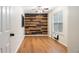 Charming bedroom featuring an accent wall, ample natural light and laminate flooring at 3372 English Oaks Nw Dr, Kennesaw, GA 30144
