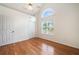 Bright bedroom featuring vaulted ceilings and a large window overlooking the property at 3372 English Oaks Nw Dr, Kennesaw, GA 30144