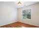 Bright bedroom with hardwood floors, neutral walls, and a window overlooking the landscape at 3372 English Oaks Nw Dr, Kennesaw, GA 30144