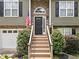 Close-up of the home's entryway featuring a classic front door and a welcoming staircase at 3372 English Oaks Nw Dr, Kennesaw, GA 30144