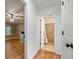 Hallway view showcasing the transition from bedroom to accessible bathroom at 3372 English Oaks Nw Dr, Kennesaw, GA 30144