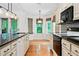 Modern kitchen with an island, a bay window dining area, and stainless steel appliances at 3372 English Oaks Nw Dr, Kennesaw, GA 30144