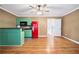 Open-concept space with bright refrigerator, breakfast bar, and hardwood flooring at 3372 English Oaks Nw Dr, Kennesaw, GA 30144