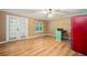 Open living space features hard wood flooring, a window, and a red refrigerator at 3372 English Oaks Nw Dr, Kennesaw, GA 30144