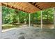 Outdoor patio area for relaxation overlooking a green backyard and fence at 3372 English Oaks Nw Dr, Kennesaw, GA 30144