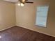 Bedroom with carpet, one window, and a ceiling fan at 5040 Brittany Dr, Stone Mountain, GA 30083