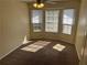 Bedroom with three windows at 5040 Brittany Dr, Stone Mountain, GA 30083