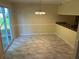 Dining area with vinyl flooring, light fixture, and sliding glass door to the outside at 5040 Brittany Dr, Stone Mountain, GA 30083