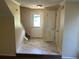 Entryway with vinyl floors and a view of the stairs at 5040 Brittany Dr, Stone Mountain, GA 30083