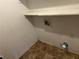Laundry room with vinyl floors and a shelf at 5040 Brittany Dr, Stone Mountain, GA 30083