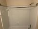 Bathroom shower featuring white tiled walls and standard shower head at 5040 Brittany Dr, Stone Mountain, GA 30083