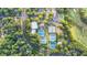 An aerial view of the community's tennis courts, clubhouse and pool surrounded by lush greenery at 5059 Winding Hills Lane Ln, Woodstock, GA 30189
