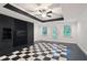 Finished basement features a black and white checkered floor and black accent wall at 5059 Winding Hills Lane Ln, Woodstock, GA 30189