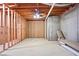 An unfinished basement with exposed ceiling, unfinished walls, and a concrete floor at 5059 Winding Hills Lane Ln, Woodstock, GA 30189