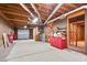 Large unfinished basement with wood frame walls and access to the garage at 5059 Winding Hills Lane Ln, Woodstock, GA 30189